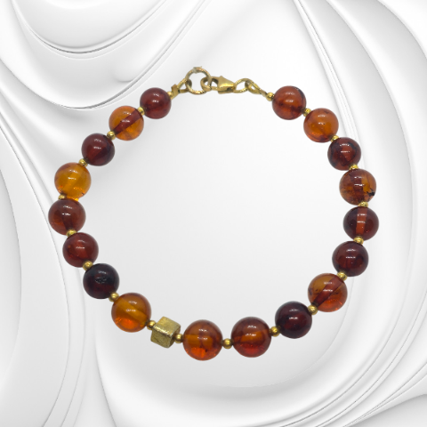 Ręcznie robiona bransoleta z bursztynem koniakowym i srebrnymi detalami