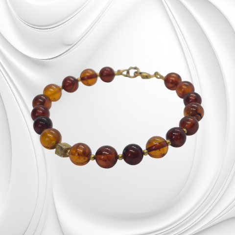 Ręcznie robiona bransoleta z bursztynem koniakowym i srebrnymi detalami