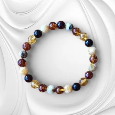 Bransoletka z kolorowych polerowanych kulek bursztynu bałtyckiego na gumce jubilerskiej