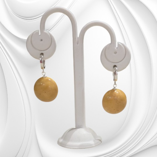 Kolczyki z miodowego bursztynu bałtyckiego na srebrnych kajdankach