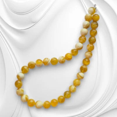 Ręcznie wykonany naszyjnik z kulek bursztynu bałtyckiego w odcieniu mleczno-słonecznym ze srebrnym zapięciem