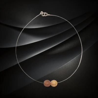Naszyjnik z dwiema matowymi kulkami bursztynu bałtyckiego w odcieniu mlecznym i koniakowym