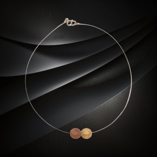 Naszyjnik z dwiema matowymi kulkami bursztynu bałtyckiego w odcieniu mlecznym i koniakowym
